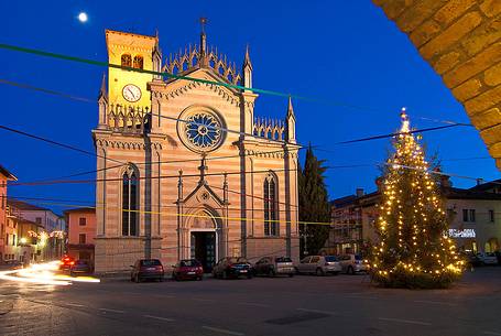 Christmas lights and cathedral in Piazza Libertà square in the ancient village of Valvasone. Friuli Venezia Giulia, Italy, Europe