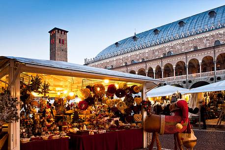 Christmas markets in Piazza della Frutta, Padua, in the background Palazzo della Ragione, Italy, Europe
