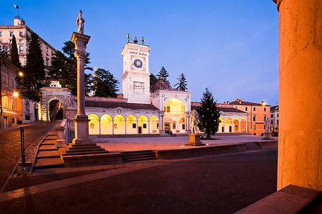 Loggia di San Giovanni, the Renaissance portico surmounted by a clock tower and the column of san Marco in Piazza della Libertą, in the background the castle, Udine, Friuli Venezia Giulia, Italy, Europe Loggia di San Giovanni, the Renaissance portico surmounted by a clock tower and the column of san Marco in Piazza della Libertą, in the background the castle, Udine, Friuli Venezia Giulia, Italy, Europe