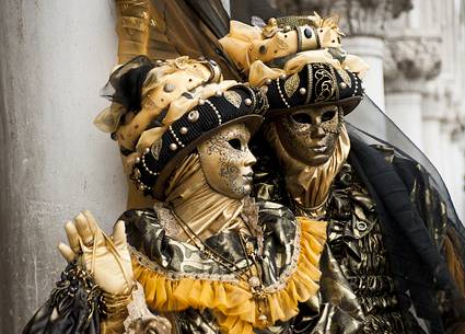 Couple in beautiful costumes during the carnival in Venice.