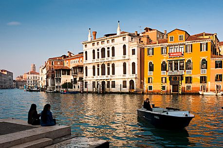 Tourists watching the Grand Canal or Canal Grande near the Accademia Bridge in Venice, Italy, Europe