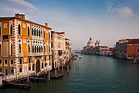 The Canal Grande, in the background the church Santa Maria della Salute,  located at Punta della Dogana in the Dorsoduro sestiere of the city of Venice, Italy