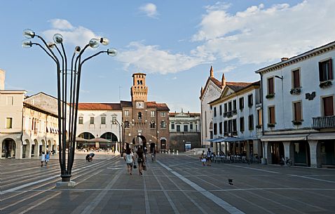 Great Square in Oderzo village. In the background the Trevisana Door or The clock Tower, symbol of the city, Veneto, Italy.