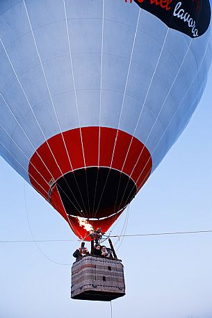 People have fun flying in a hot air balloon during the hot air balloon festival in Udine, Friuli Venezia Giulia, Italy, Europe