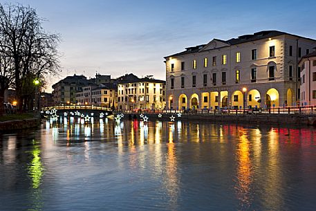 The Christmas lights are reflected on the river Sile in Treviso city, Veneto, Italy, Europe