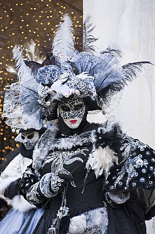 Masks of the Venice carnival in Piazza San Marco square, Venice, Italy, Europe