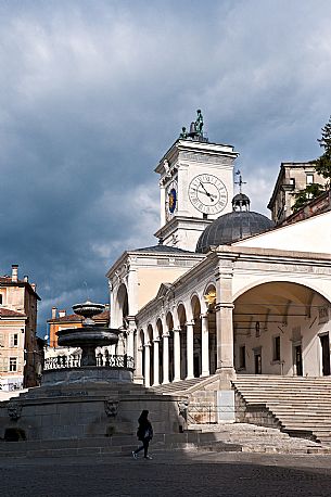 Piazza Libertà square with clock tower, loggia of San Giovanni and the Carrara Renaissance fountainin,Udine, Friuli Venezia Giulia, Italy