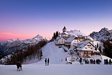 The iconic village of Monte Lussari mount in a winter sunset, Tarvisio, Julian Alps, Friuli Venezia Giulia, Italy, Europe