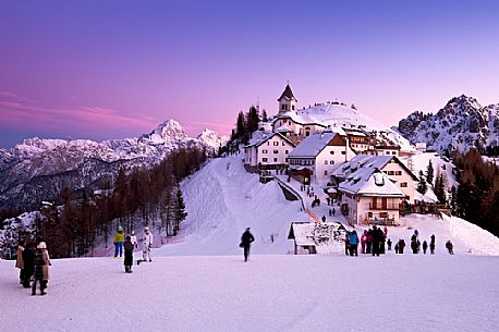 The iconic village of Monte Lussari mount in a winter sunset, Tarvisio, Julian Alps, Friuli Venezia Giulia, Italy, Europe