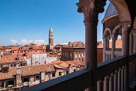 The bell tower and the Cathedral of San Marco in Venice seen from the spiral staircase of Palazzo Contarini del Bovolo, a late Gothic building located in the San Marco district. Italy