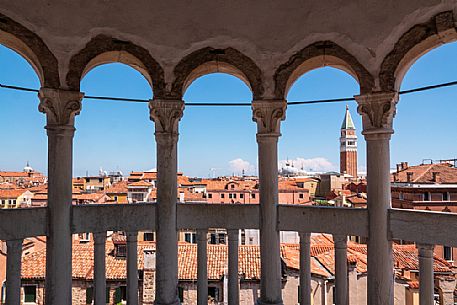 The bell tower and the Cathedral of San Marco in Venice seen from the spiral staircase of Palazzo Contarini del Bovolo, a late Gothic building located in the San Marco district. Italy