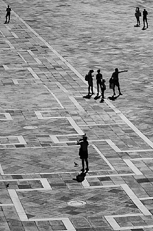 Tourists in Piazza San Marco in Venice on a warm sunny day. Italy