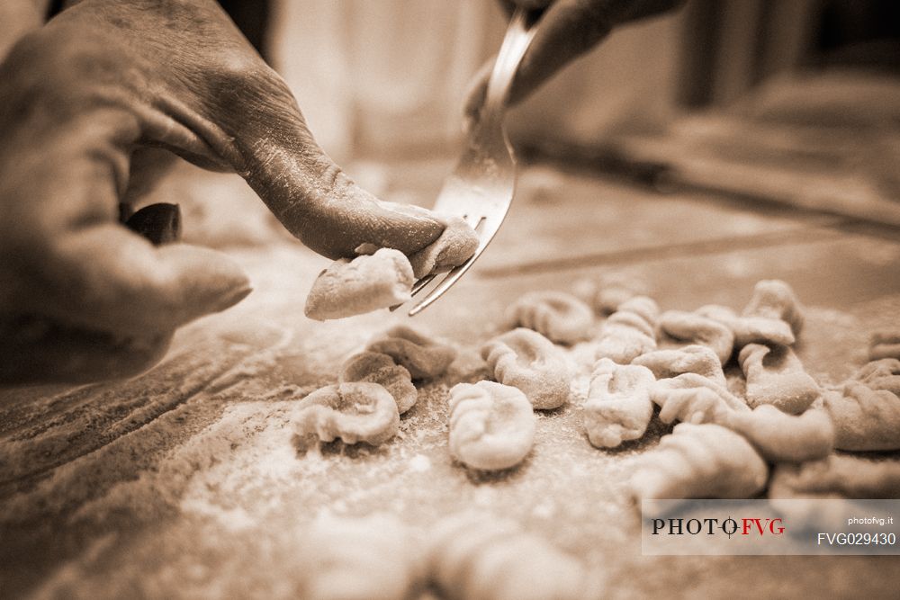 The chef preparing gnocchi, Italy