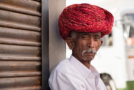 Portrait of old rajasthani Indian man with red turban, Pali, Rajasthan, India