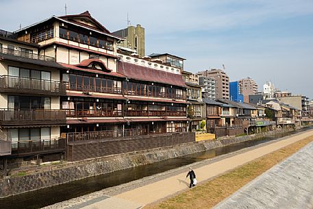 The old and the new city on the Kamo river, Kyoto, Japan