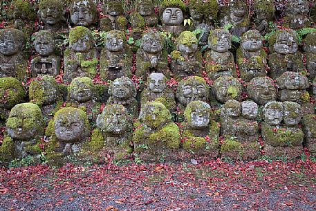 Some of the 1200 Rakan statues in Otagi Nenbutsu-ji temple in Arashiyama, Kyoto, Japan