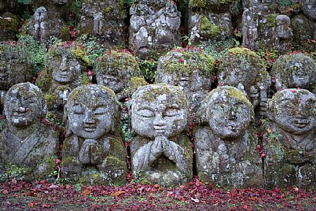 Some of the 1200 Rakan statues in Otagi Nenbutsu-ji temple in Arashiyama, Kyoto, Japan