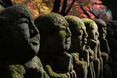 Some of the 1200 Rakan statues in Otagi Nenbutsu-ji temple in Arashiyama, Kyoto, Japan