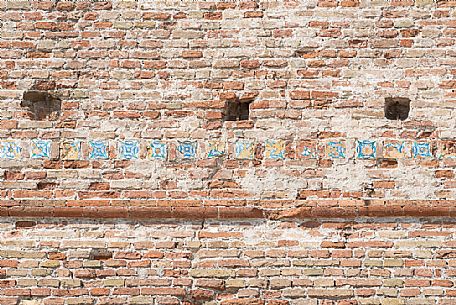 Detail of some tiles on the walls of Castel Sismondo, a castle in the center of Rimini, Emilia Romagna, Italy, 