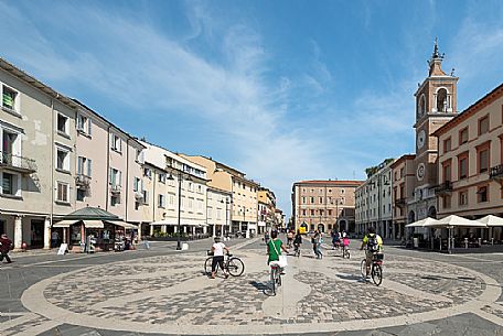 People in the Tre Martiri square, in the background the clock tower, downtown of Rimini, Emilia Romagna, Italy, Europe