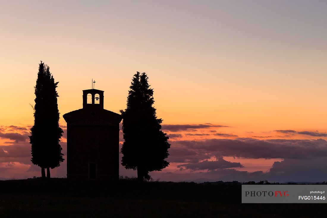 Silhouette on sunset of the chapel of Madonna di Vitaleta