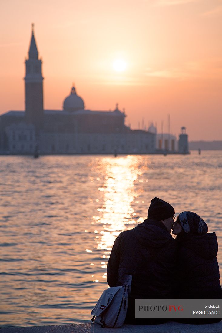 Romantic scene on sunset in front of the Basilica of St Giorgio Maggiore 