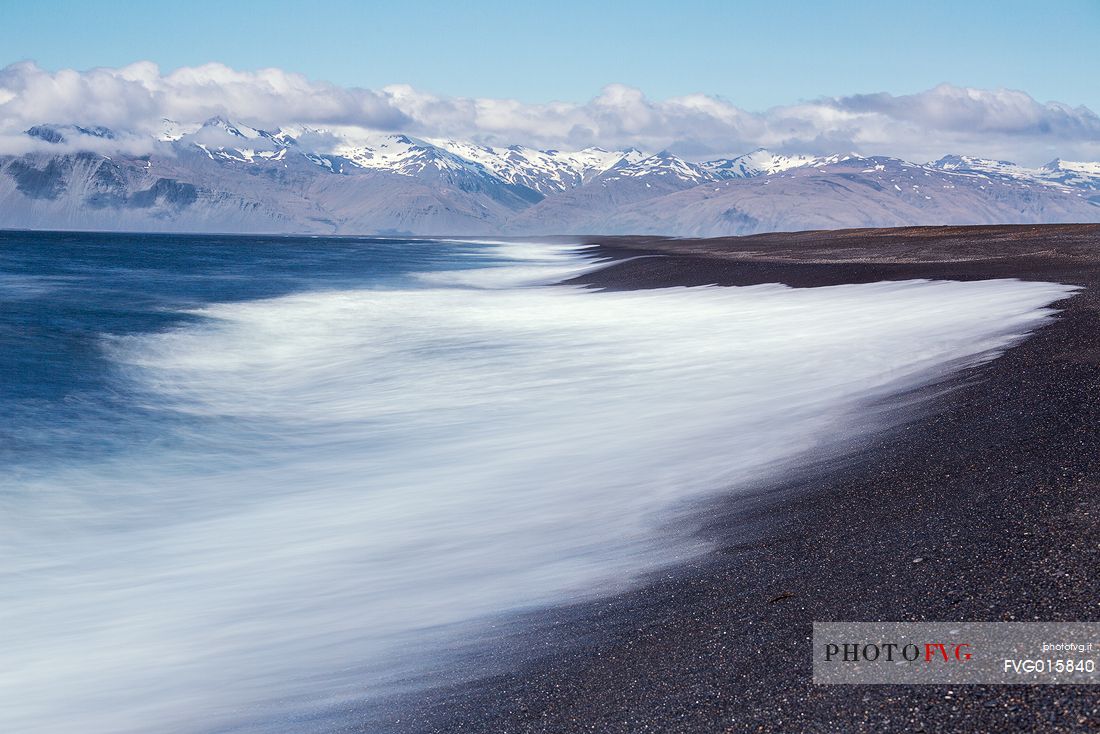 Waves crashing on the black beach in the east coast of Iceland