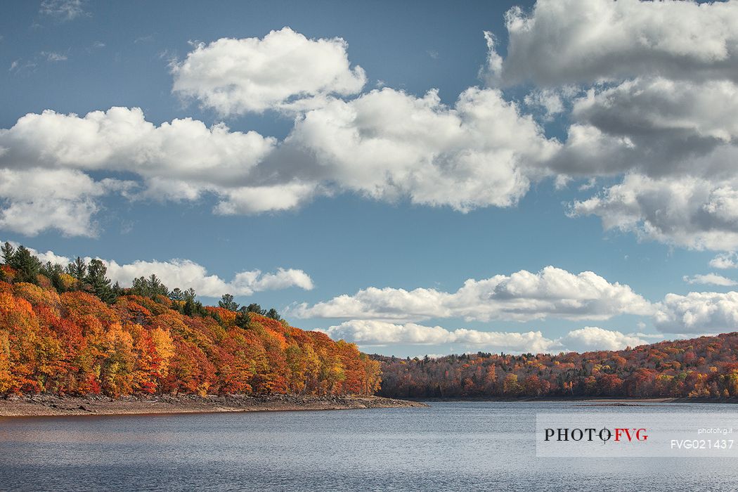 Clouds and autumn colors on lake at Woodstock, Vermont, United States of America