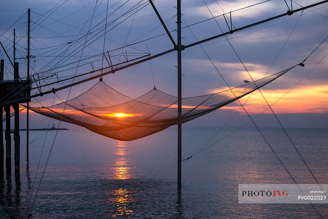 Fishing net on the beach at dawn, Sottomarina, Chioggia, venetian lagoon, Italy