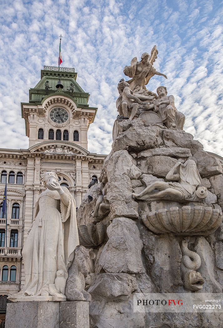The fountain of the Four Continents and the Town Hall on background, Trieste, Italy