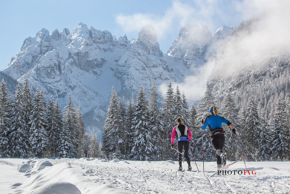 Cross country skiing in Cortina Dobbiaco trail, in the background the Piz Popena and Cristallo Mount, Pusteria valley, Italy