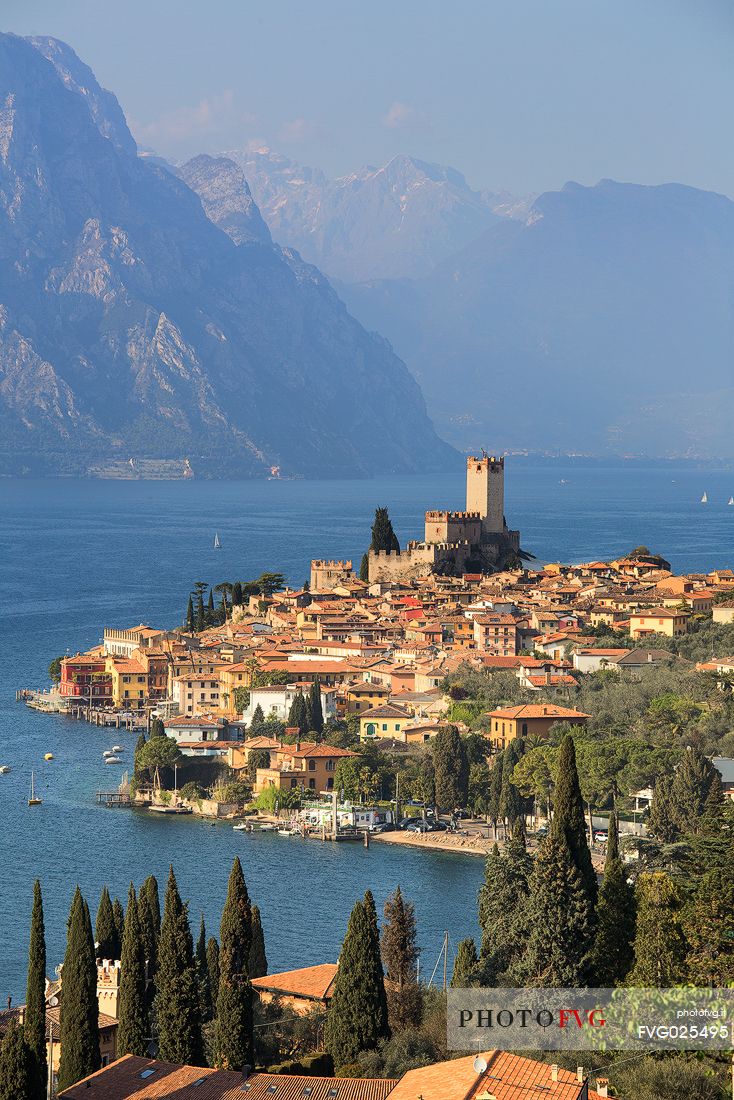 View from the top of the small medieval village of Malcesine with  the Scaligero castle overlooking Garda lake, Italy