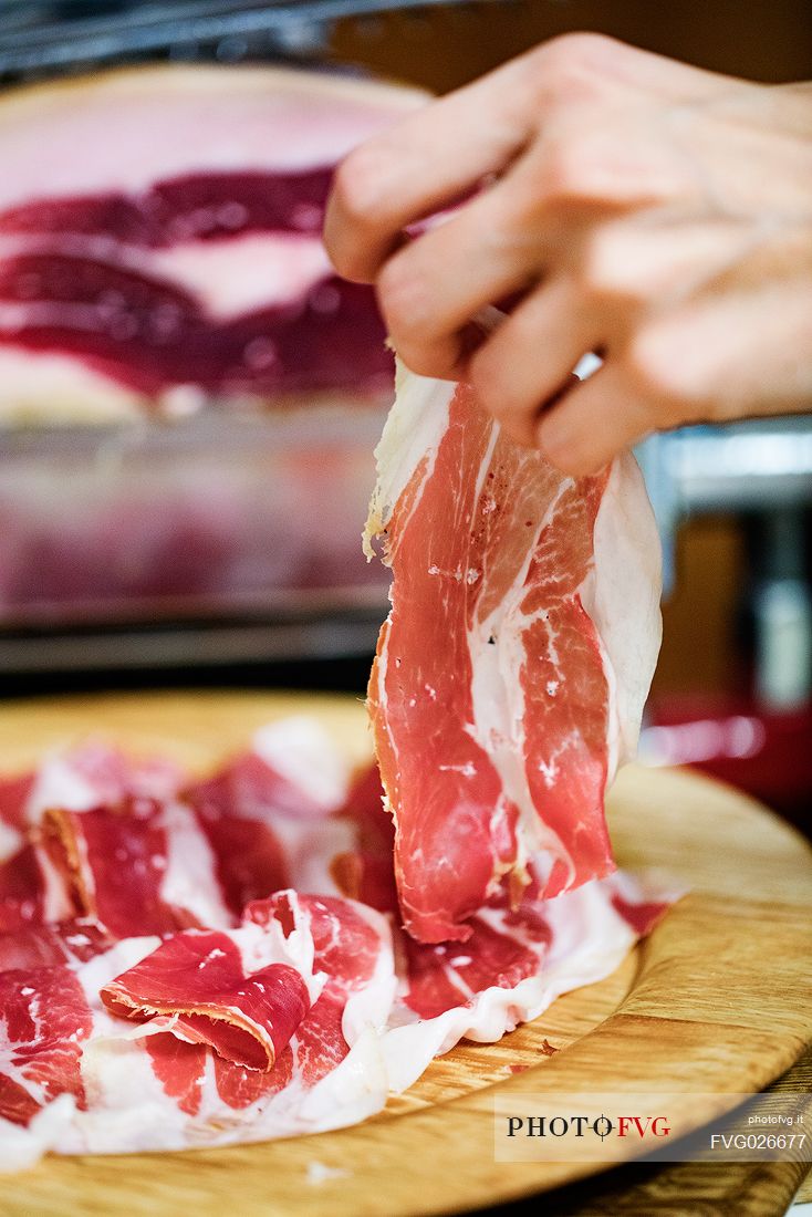 Freshly sliced am cutting board of the historic ham company D'Osvaldo in Cormons, Friuli Venezia Giulia, Italy