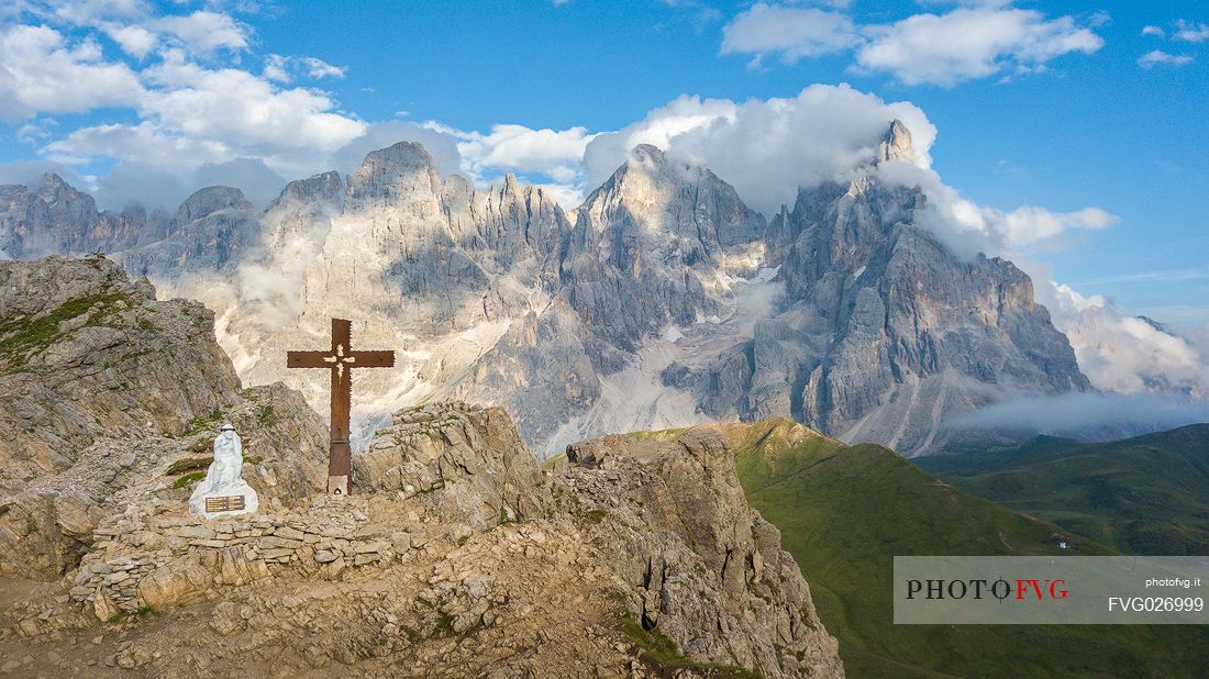 The northern chain of the Pale di San Martino and the cross with the statue of  Cristo Pensante, Dolomites, San Martino di Castrozza, Italy