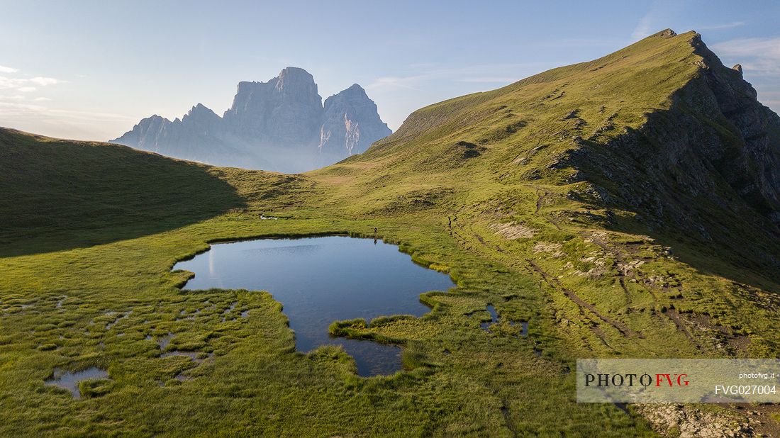 Pelmo Mount, Baste lake and the meadows of Mondeval during a summer morning, Dolomites, Italy