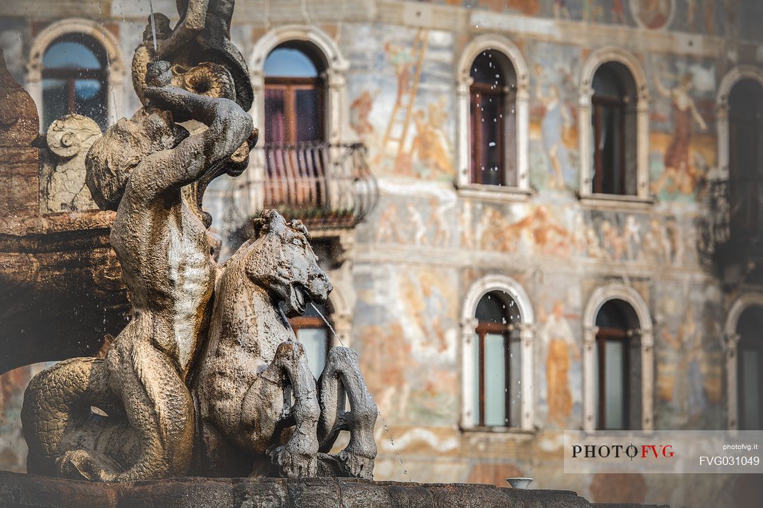 The fountain of Nettuno and the frescoes on the Cazuffi-Rella houses in Duomo square, Trento, Trentino Alto Adige, Italy