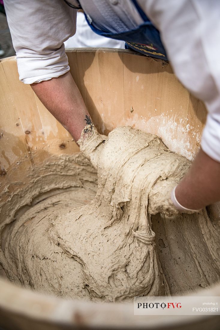 Bread preparation during the traditional bread and strudel festival in Duomo square, Bressanone, Isarco valley, Alto Adige, Italy, Europe