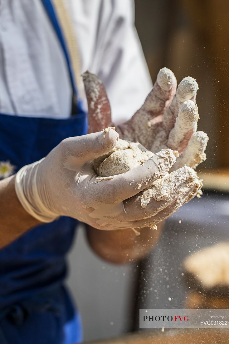 Bread preparation during the traditional bread and strudel festival in Duomo square, Bressanone, Isarco valley, Alto Adige, Italy, Europe