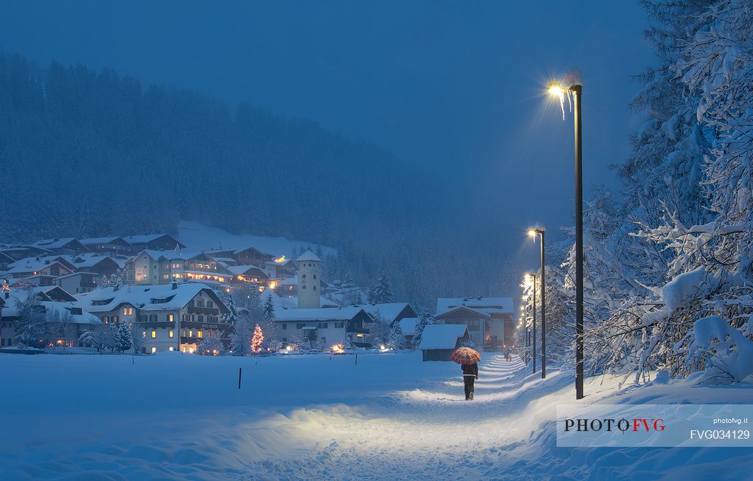 The Moso village at twilight during a snowfall, Sesto, dolomites, Pusteria valley, Trentino Alto Adige, Italy, Europe