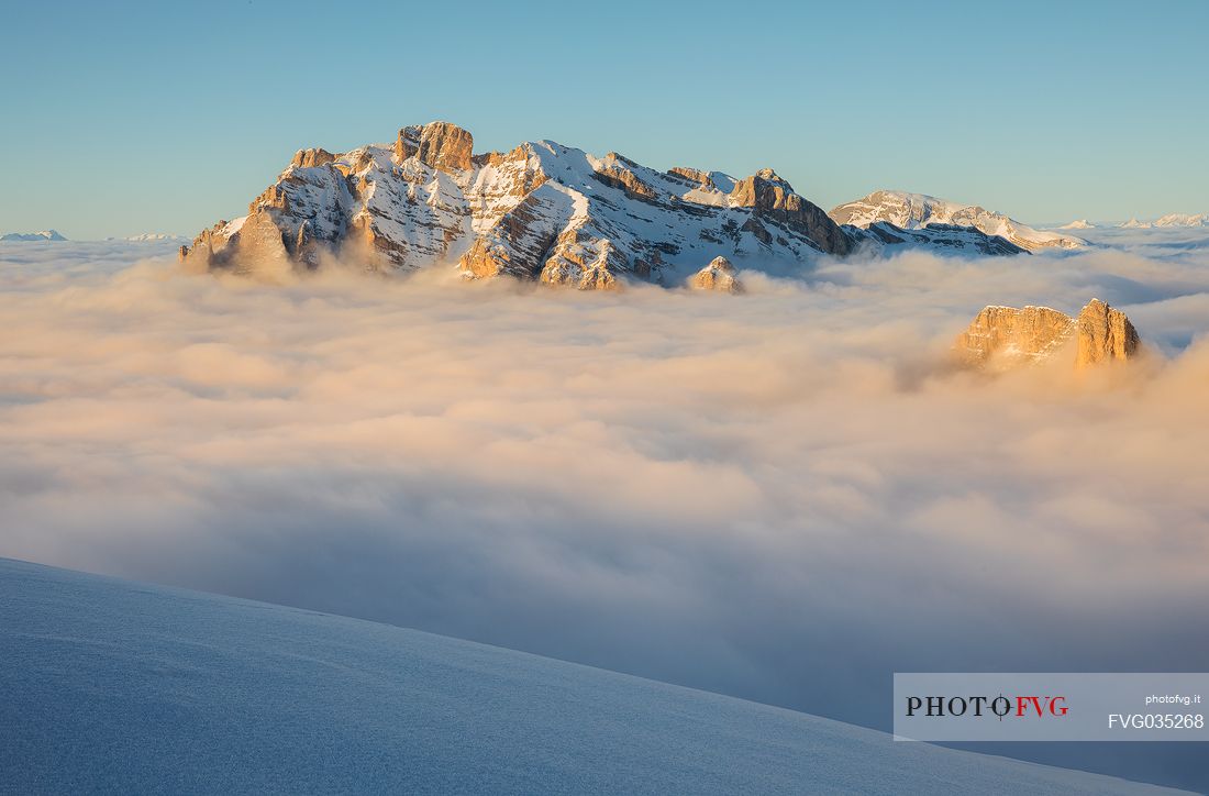 The Conturines mount at sunset above a sea of clouds, Badia valley, dolomites, South Tyrol, Italy, Europe