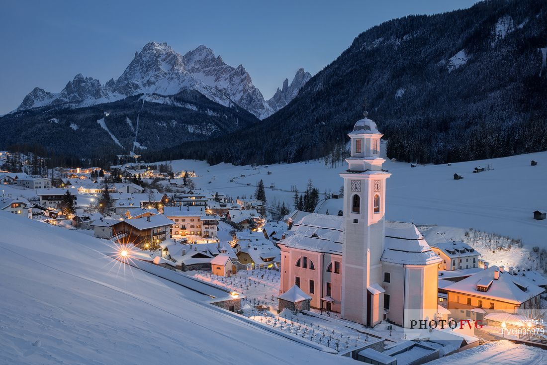 The village of Sesto with its church by night, Pusteria valley, Trentino Alto Adige, Italy