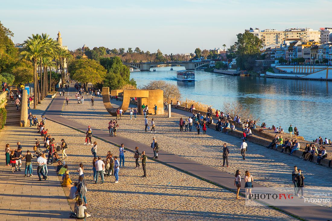 Tourists in the El Arenal district separated from the Triana district by the Guadalquivir river, Seville, Andalusia, Spain, Europe