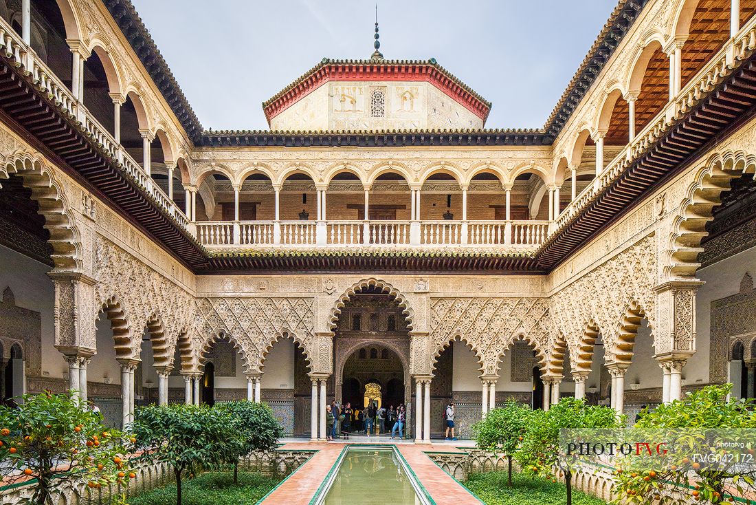 Patio de las Doncellas in the Real Alcazar palace, the lower part with plaster arches and stuccoes is in Mudejar style while the upper loggia shows the influence of the Italian Renaissance, Seville, Andalusia, Spain, Europe