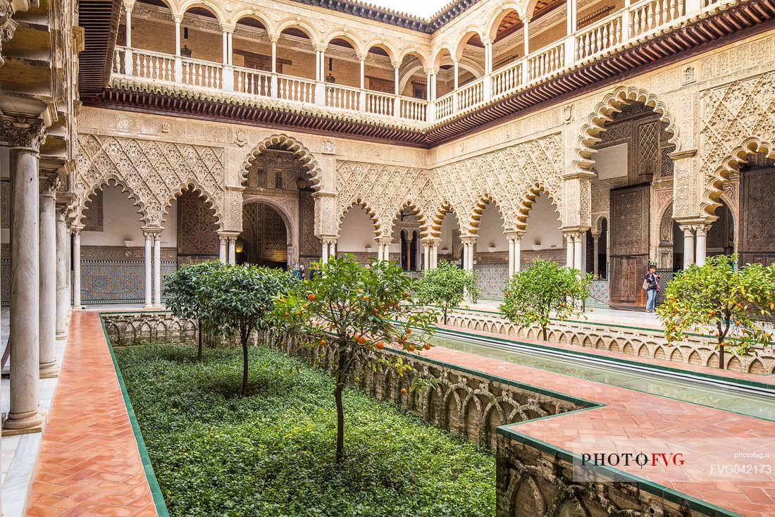 Patio de las Doncellas in the Real Alcazar palace, the lower part with plaster arches and stuccoes is in Mudejar style while the upper loggia shows the influence of the Italian Renaissance, Seville, Andalusia, Spain, Europe