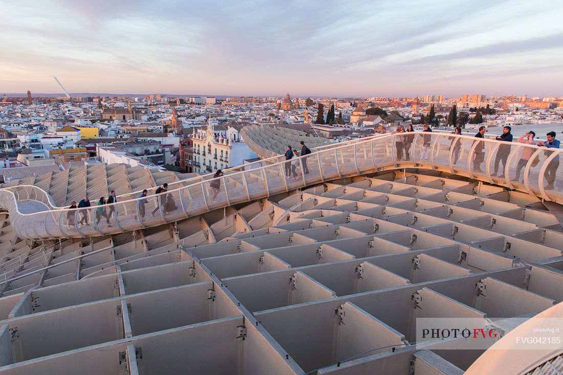 Sunset over the city of Seville from the roof of Metropol Parasol on plaza de la Encarnacion, commonly called Setas, a contemporary architecture project built entirely of wood, Seville, Andalusia, Spain, Europe