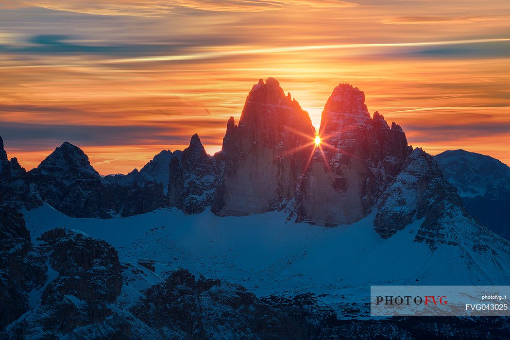 The sun rise between the Tre Cime di Lavaredo from the Picco di Vallandro over Prato Piazza valley in the Fanes Senes Braies natural park, dolomites, Pustertal, South Tyrol, Italy, Europe