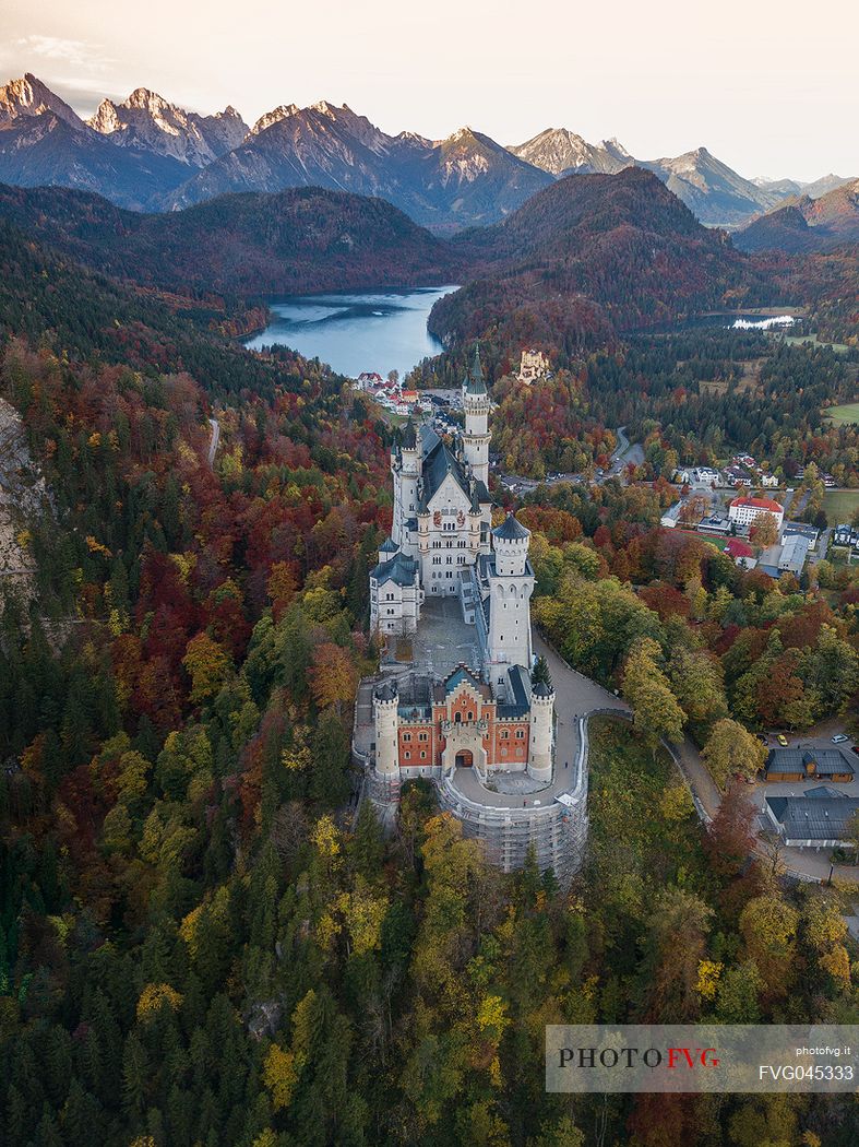 Neuschwanstein Castle, Schloss Neuschwanstein  and lake Alpsee against Tannheim Mountains in autumn, Schwangau near Fuessen, Bayern, Germany, Europe