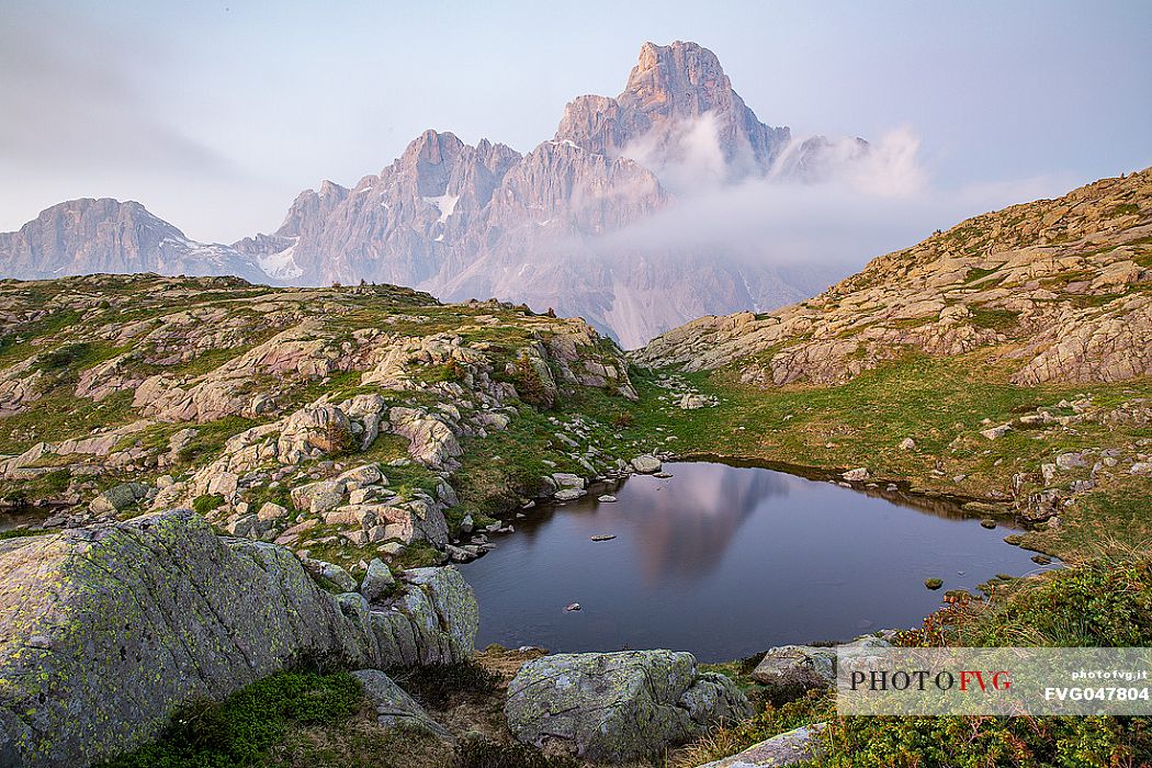 The Cimon della Pala peak reflected on the Cavallazza lake, Pale di San Martino group, San Martino di Castrozza, dolomites, Trentino Alto Adige, Italy, Europe