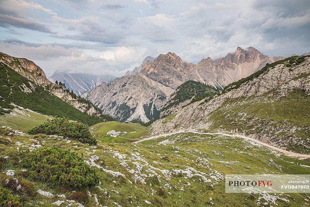 Colli Alti hut from above and in the background the Croda del Becco peak, Braies valley, dolomites, Trentino Alto Adige, Italy, Europe Colli Alti hut from above and in the background the Croda del Becco peak, Braies valley, dolomites, Trentino Alto Adige, Italy, Europe