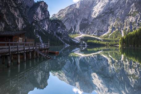 The hut and the Croda del Becco reflecting in the Braies lake 